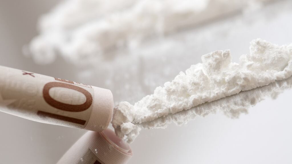 A woman who said she was forced to ingest 51 pellets of cocaine by a man she believed she was meeting to confirm a modelling contract with, has been jailed for importing the drug.