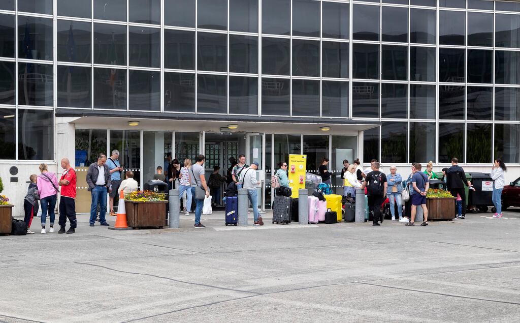 14/07/2022 People outside the old terminal building at Dublin Airport pictured this afternoon. New arrivals to Ireland fleeing war in Ukraine and other asylum seekers are staying at the old terminal due to a lack of state provided accomodation.... Picture Colin Keegan, Collins Dublin