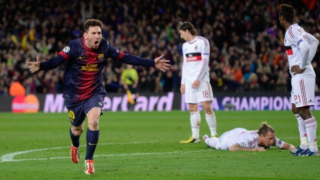 Lionel Messi celebrates after scoring their second goal during the Champions League round of 16 second leg match between FC Barcelona and AC Milan at Camp Nou stadium