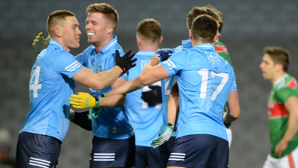 Con O Callaghan and Robert McDaid celebrate at the final whistle. Photograph: Dara Mac Dónaill