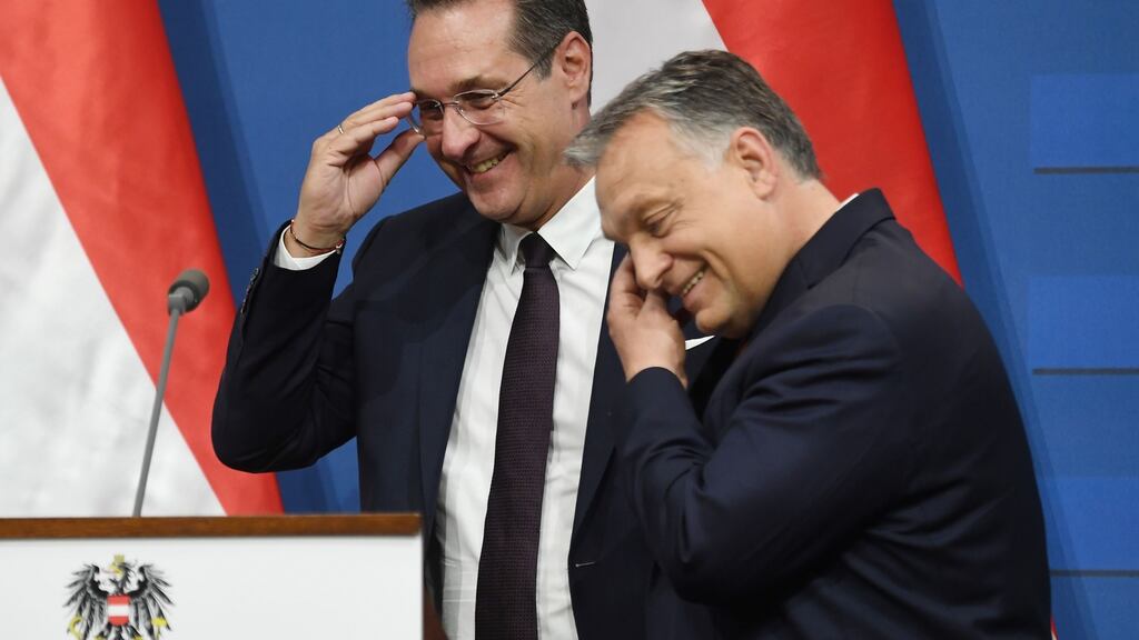 Austria’s vice-chancellor and chairman of the Freedom Party FPOe Heinz-Christian Strache talks with Hungarian prime minister Viktor Orban (right) at the end of a press conference at the Carmelite monastery of the prime minister’s office in Budapest on Monday. Photograph: Attila Kisbenedek/AFP/Getty