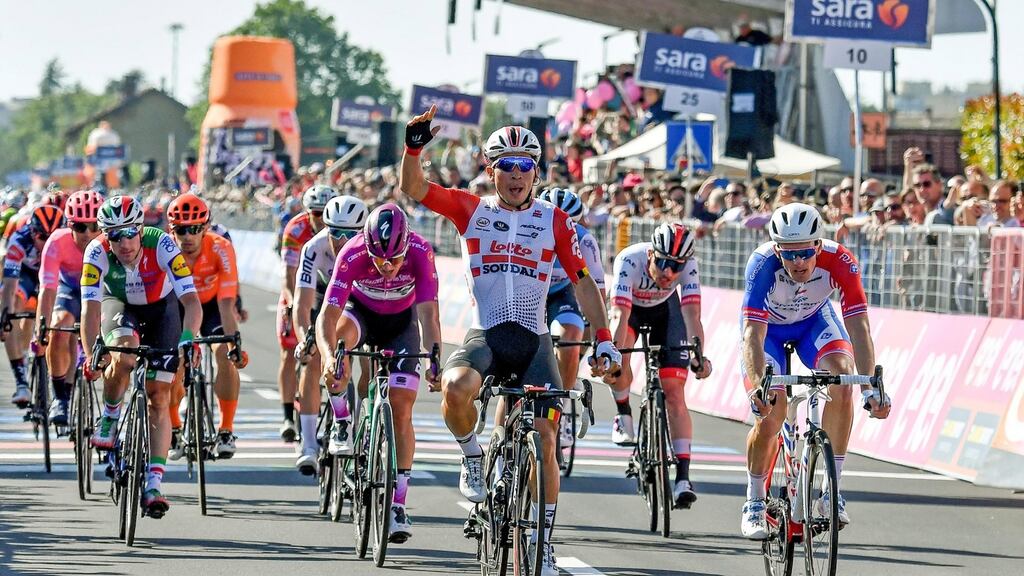 Australian rider Caleb Ewan (C) of Lotto Soudal team celebrates winning the 11th stage of the Giro d’Italia. Photo: Alessandro Di Meo/EPA