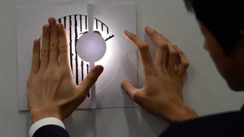 Daniel Zion Kang of the USA with his paintable electronics at the European Union Contest for Young Scientists at the RDS. Photograph: Cyril Byrne/The Irish Times