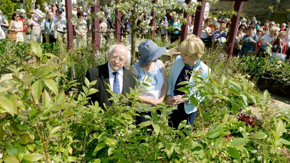 President Michael D Higgins with his wife, Sabina, speak to Jane McCorkell in the Keelings garden at Bloom in the Phoenix Park, Dublin, yesterday. Photograph: David Sleator