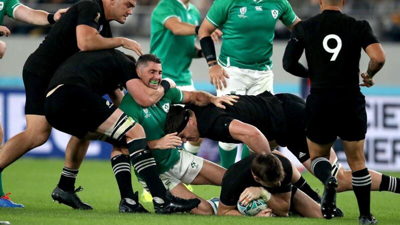 Ireland’s Rob Kearney is tackled by New Zealand’s Kieran Read. Photograph: Dan Sheridan/Inpho