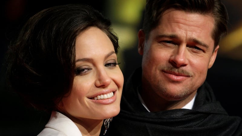Angelina Jolie and Brad Pitt: their alliance began with a movie about marriage – and now appears to have ended with one. Photograph: Hannibal Hanschke/Reuters