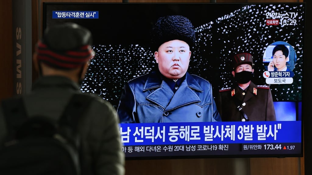 A man watches a television news broadcast showing file footage of North Korea’s leader Kim Jong Un, at a railway station in Seoul on Monday. Photograph: AFP via Getty Images