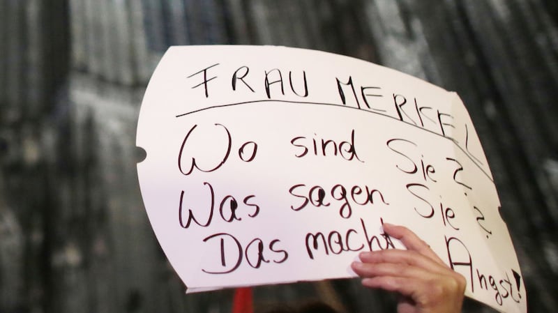 A sign at a demonstration in Cologne on January 5th reading: “Angela Merkel – Where are you? What do you say? It is frightening.” Photograph: Oliver Berg /AFP/Getty Images