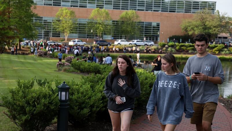 Students and faculty file out of buildings during a lockdown after a shooting on the campus of University of North Carolina Charlotte in University City, Charlotte, after a shooting. Photograph: Logan Cyrus/AFP/Getty Images