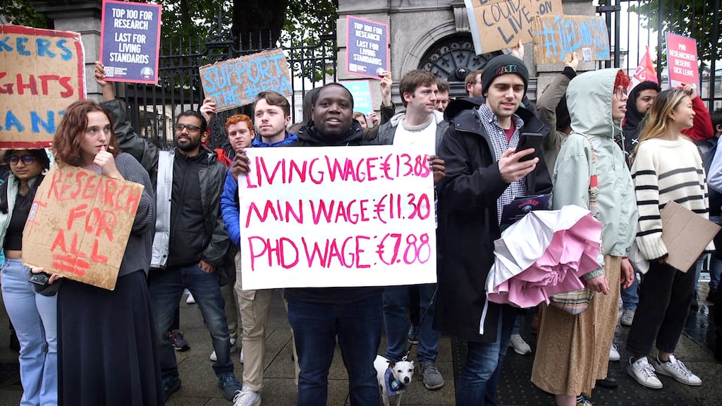 PhD researchers from universities across the country take part in the demonstration outside Leinster House on Thursday. Photo: Bryan O'Brien