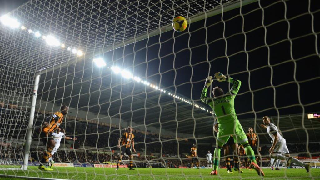 Swansea player Chico Flores (right) equalises for Swansea goal past Hull goalkeeper Allan McGregor during the Premier league match between Swansea City and Hull City at the Liberty Stadium. Photograph: Stu Forster/Getty Images