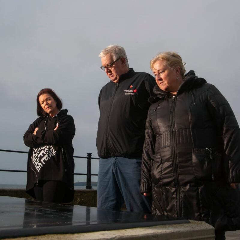 Áine Phelan with John and Denise Kelly from the Order of Malta at the memorial sculpture. Photograph: Patrick Browne
