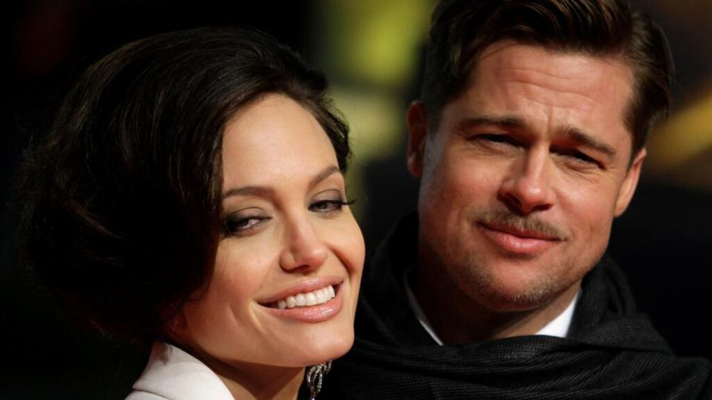 Angelina Jolie and  Brad Pitt: “a perfect blank canvas, the pleasingly beautiful couple on the red carpet”. Photograph: Reuters/Hannibal Hanschke