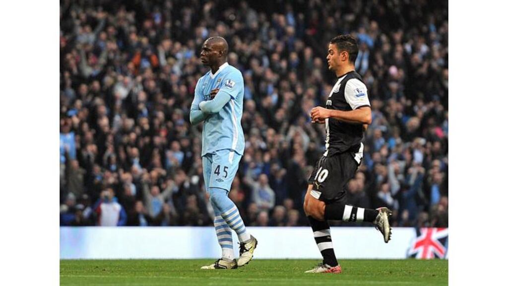 Manchester City's Mario Balotelli ‘celebrates’ his side's first goal against Newcastle. Photograph: Martin Rickett/PA Wire.