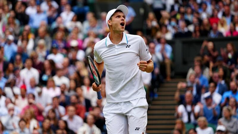 Poland’s Hubert Hurkacz of Poland celebrates winning match point during his men’s singles quarter-final against Roger Federer at Wimbledon. Photograph: Mike Hewitt/Getty Images