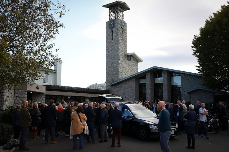 Mourners outside the church alongside the hearse on Monday. Photograph: Dan Dennison/The Irish Times