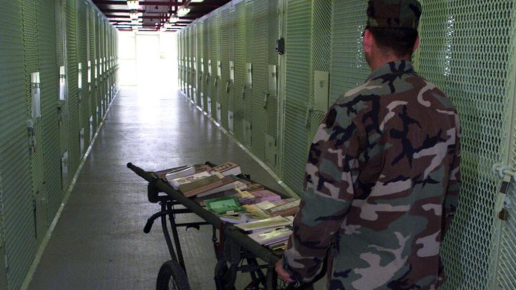 A librarian pushes a book cart in Guantanamo Bay, Cuba. Photograph: Getty Image