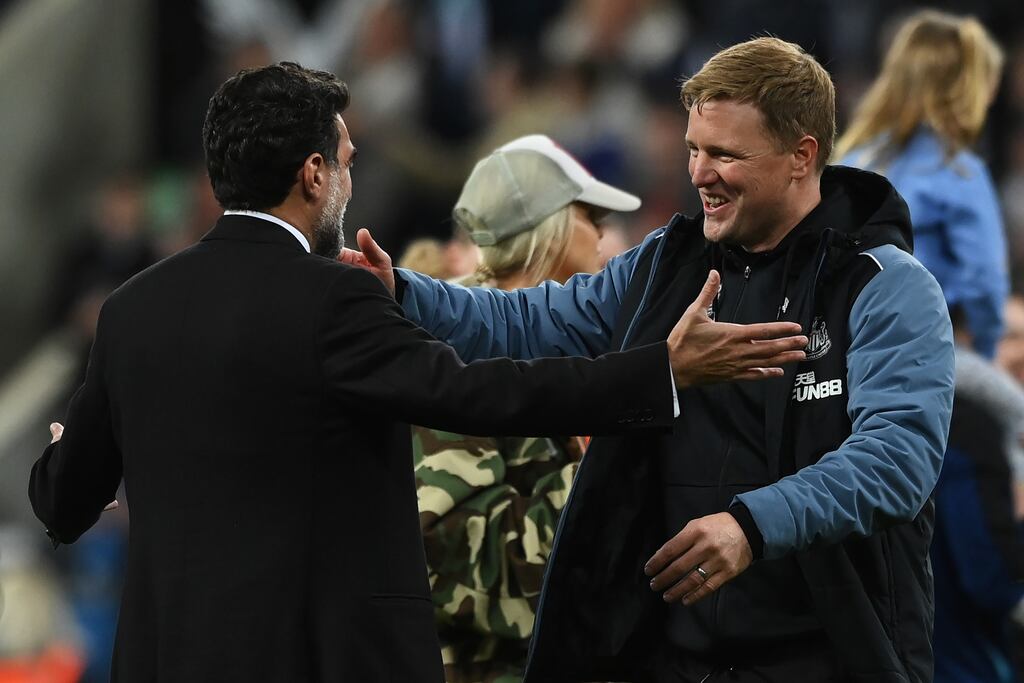 Newcastle United manager Eddie Howe embraces club co-owner Mehrdad Ghodoussi after their team qualifies for the Champions League. Photograph: Getty Images