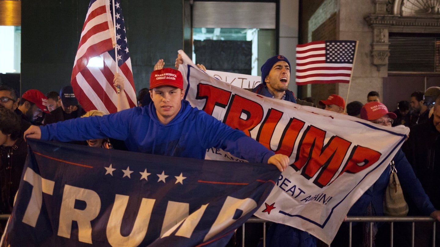 US Republican presidential nominee Donald Trump supporters rally near the intersection of West 54th Street and Fifth Avenue in New York. Photograph: Alex Wroblewski/Reuters