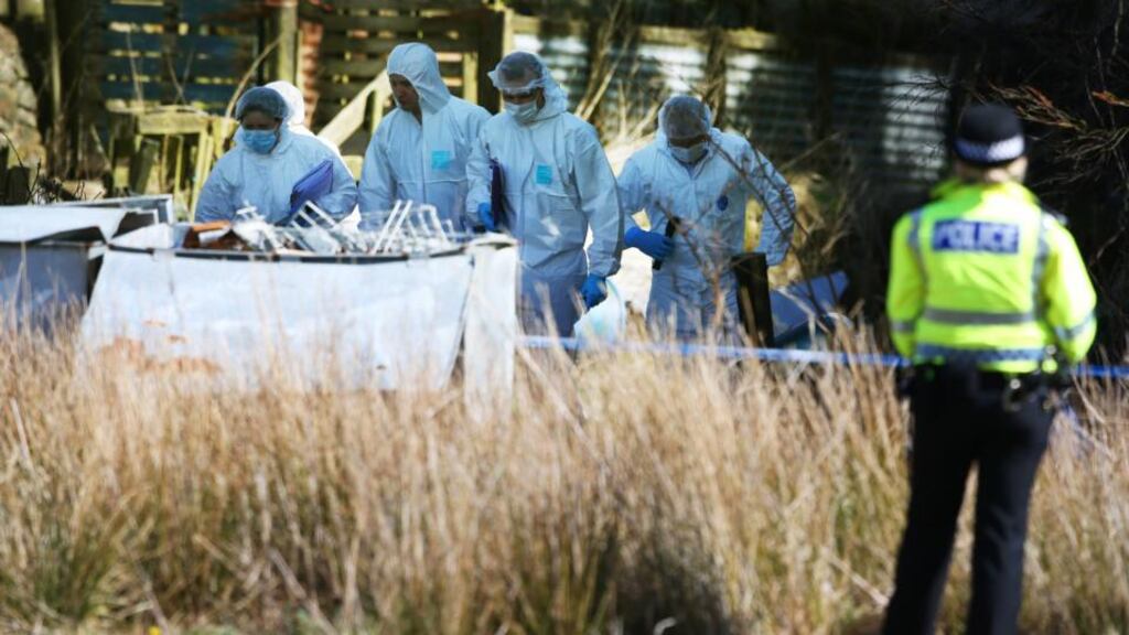 Police forensic investigators at High Craigton Farm on the outskirts of Glasgow, where the remains of Karen Buckley were found. Photograph: Andrew Milligan/PA wire