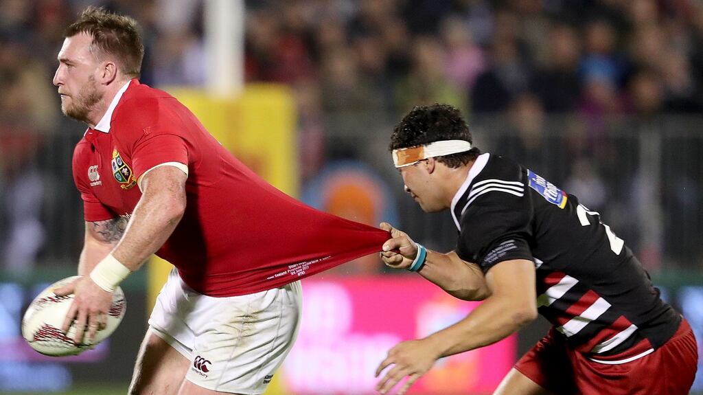 Stuart Hogg is tackled by Jonah Lowe of the Barbarians. Photograph: Dan Sheridan/Inpho