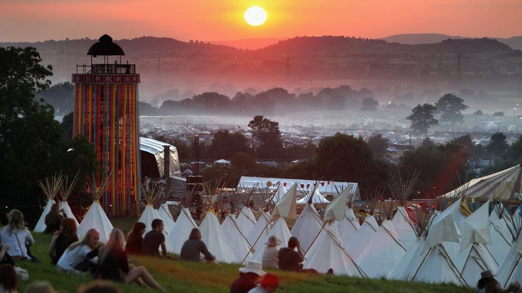 The sun sets over Worthy Farm in Somerset as music fans start to arrive for the Glastonbury Festival. Photograph: Matt Cardy/Getty Images