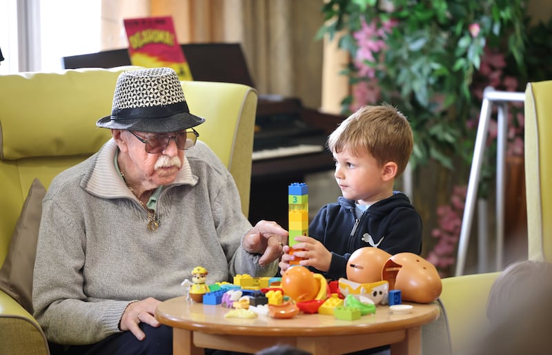 John Donohoe at Silver Stream Nursing Home enjoys time with Troy from Happy Days. Photograph: Dara Mac Dónaill