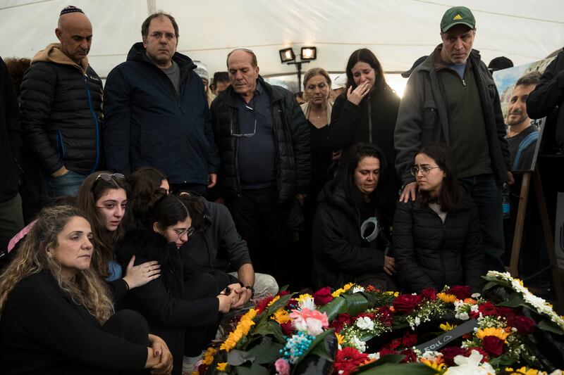 Family and friends mourn during a funeral for Capt Nir Binyamin, who was killed in a battle in south Gaza on Tuesday. Photograph: Amir Levy/Getty Images
