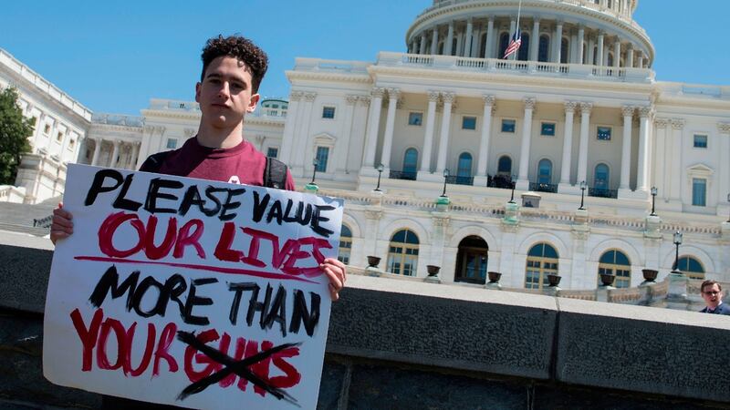 Amit Dadon, a graduate in 2017 from Marjory Stoneman Douglas High School, poses on the West Lawn of the US Capitol after rallying with several hundred students to call for stricter gun laws in Washington, DC, on Friday, April 20th, 2018. Photograph: Andrew Caballero/AFP/Getty Images