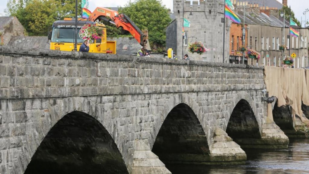 The scene at Thomond Bridge in Limerick, where two men drowned after the platform they were working on plunged into the River Shannon. Photograph Liam Burke/Press 22
