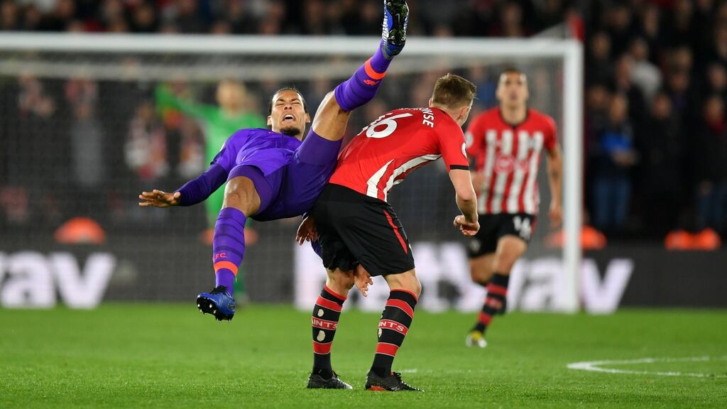 Liverpool’s Virgil Van Dijk falls after a tackle by Southampton’s James Ward-Prowse during the Premier League match at St Mary’s Stadium. Photograph: Dan Mullan/Getty Images