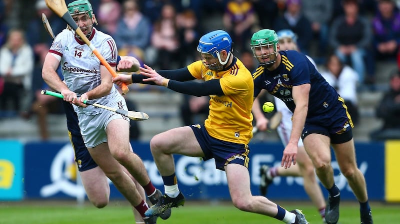 Galway’s Brian Concannon shoots past Wexford’s Mark Fanning to score a goal during the Leinster SHC match at Chadwicks Wexford Park. Photograph: Ken Sutton/Inpho