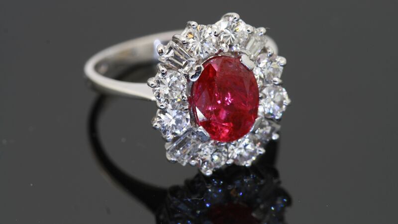 A ruby and diamond cluster ring, in 18kt white gold. €7,950 at JW Weldon
