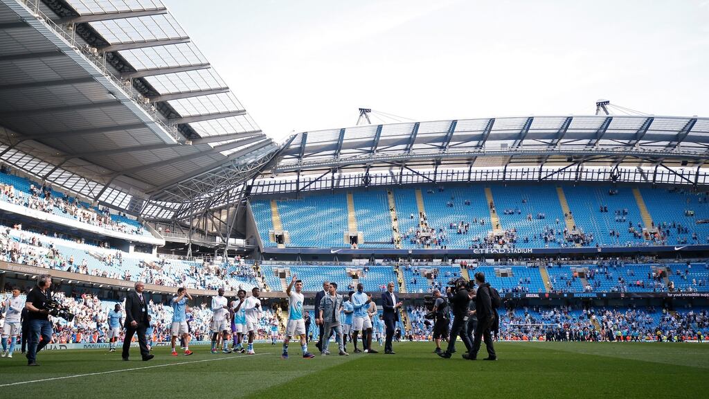 Manuel Pellegrini and his Manchester City side return to the pitch for a lap of appreciation after their 1-1 draw with Arsenal. Photograph: Reuters