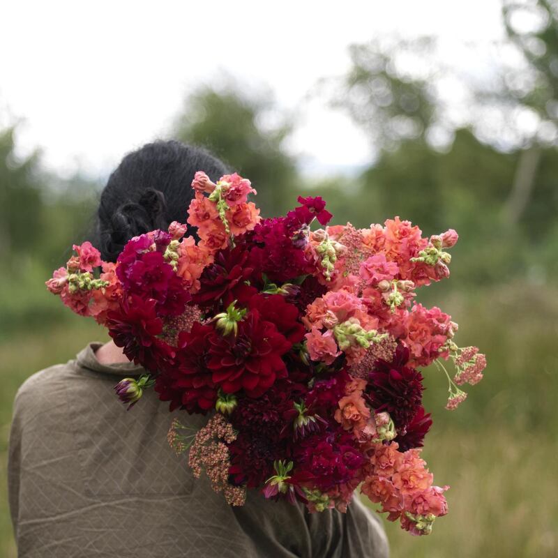 Fionnuala holding a bunch of snapdragons and dahlias from her garden last year. Photograph: Richard Johnston