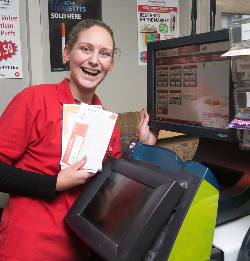Jenny O’ Carroll from Clontarf beside an operational Lotto machine at Spar newsagents on Liffey Street, Dublin.