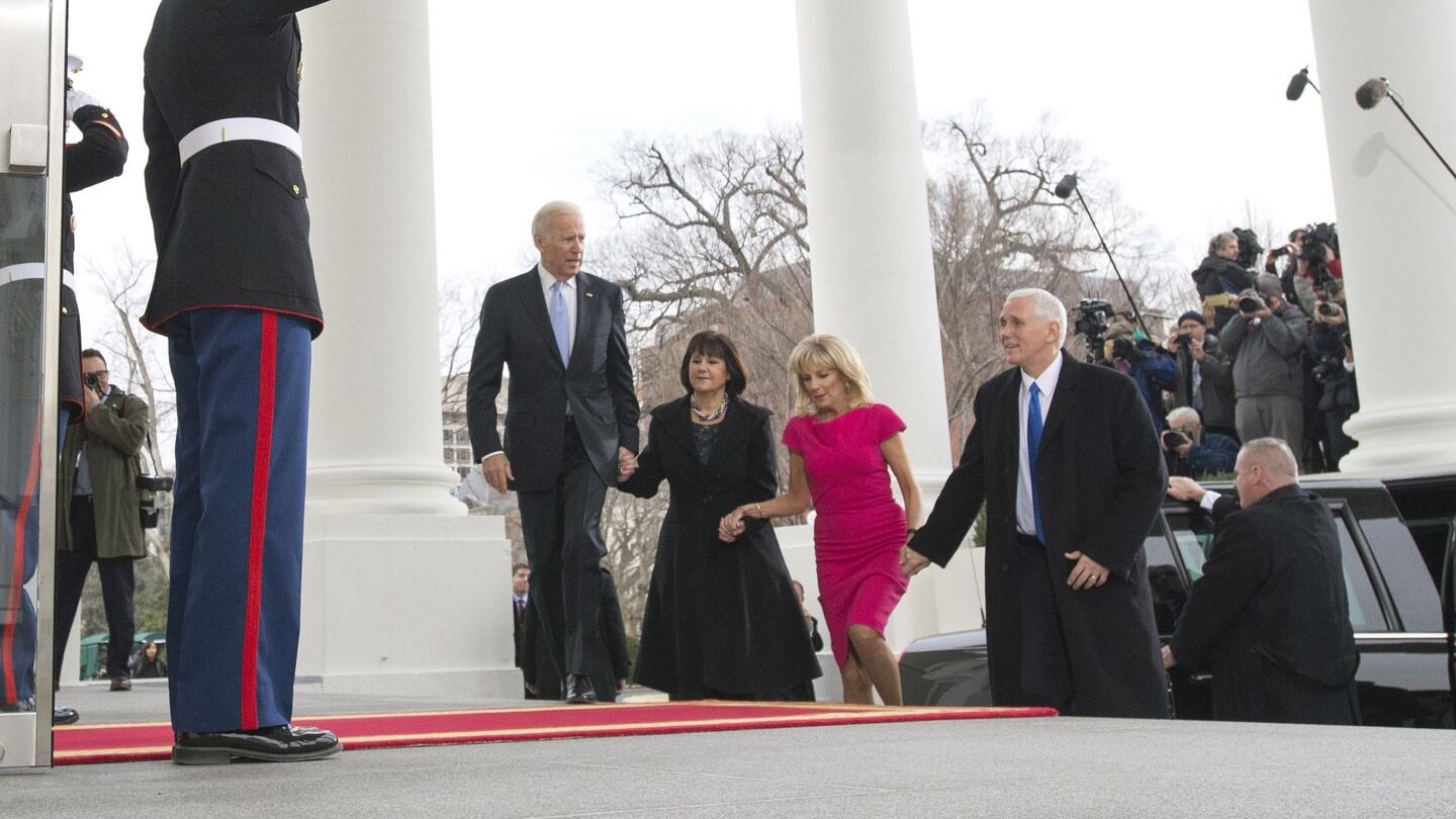 Vice president Joe Biden and his wife Jill walk with vice president-Elect Mike Pence and his wife Karen as they arrives at the White House prior to the inauguration. Photograph: Kevin Dietsch-Pool/Getty Images