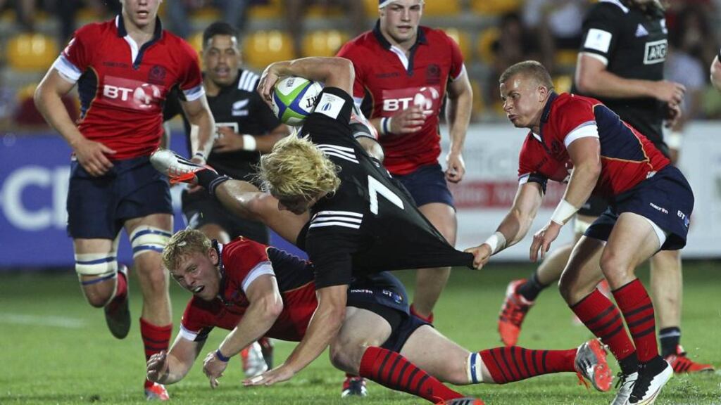 Mitchell Karpik of New Zealand is challenged by Alec Coombes and Ben Vellacott of Scotland during their World Rugby U20 Championship 2015. Photo: Marco Luzzani/Getty Images