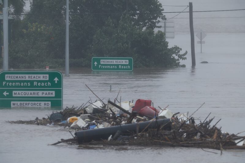 Debris and submerged road signs poke out of floodwater along the Hawkesbury River near the Windsor Bridge in the Sydney suburb of Windsor on July 4th. Photograph: Jenny Evans/Getty Images