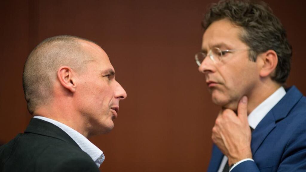 Yanis Varoufakis, Greece’s finance minister, left, speaks as Jeroen Dijsselbloem, Dutch finance minister and head of the group of euro-area finance ministers, reacts during a meeting of European finance ministers in Brussels, Belgium, on Monday, May 11, 2015. (Photograph: Jasper Juinen/Bloomberg)