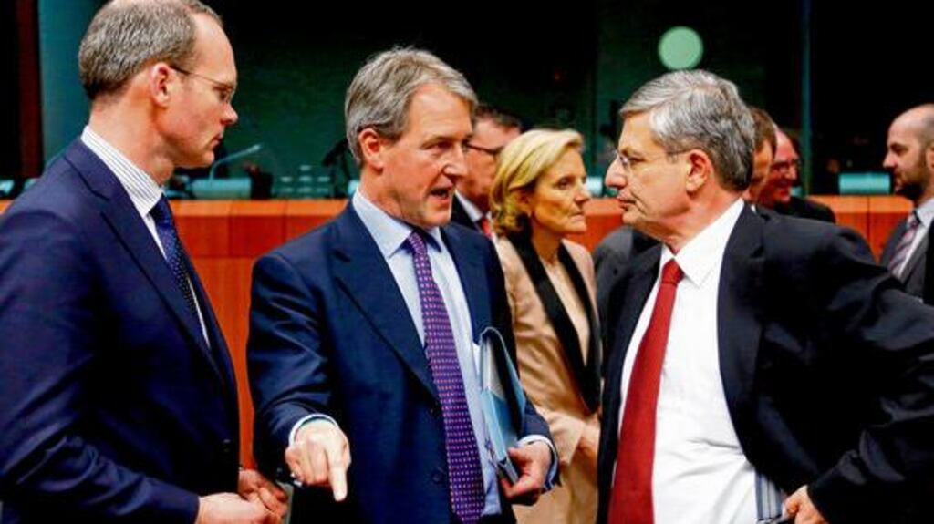 Minister for Agriculture Simon Coveney, Britain's environment secretary Owen Paterson and European health and consumer policy commissioner Tonio Borg attend a meeting in Brussels yesterday to discuss responses to the discovery of horse meat in beef products in several EU countries. photograph: reuters