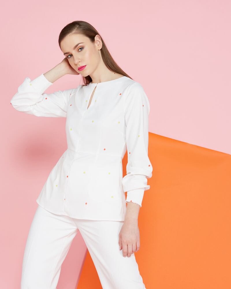 Lennon Courtney at Dunnes Stores: print keyhole top €49, white high wide-leg trousers €79