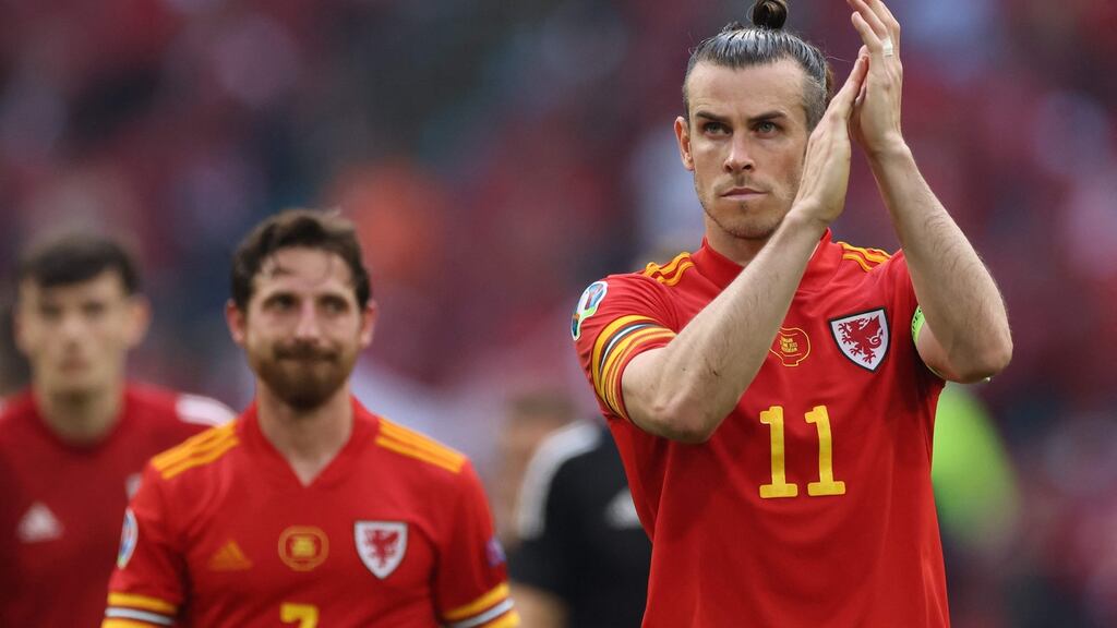 Wales captain Gareth Bale applauds the travelling fans in Amsterdam after the defeat to Denmark. Photograph: Kenzo Tribouillard/AFP via Getty Images
