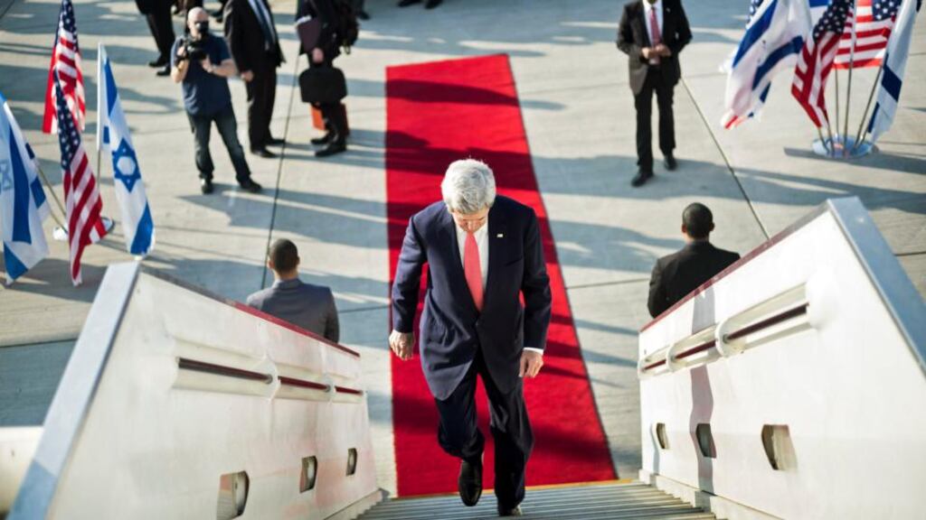 US secretary of state John Kerry boards his plane at Ben Gurion International Airport in Tel Aviv yesterday. His comments today hint at a thawing of relations between the US and Iran. Photograph: Reuters