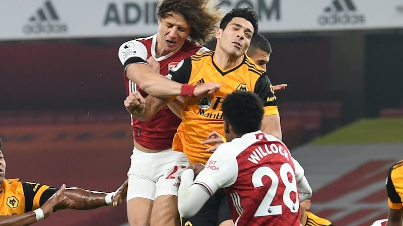 David Luiz clashes heads with Raúl Jiménez of Wolves during the Premier League match. Photograph: David Price/Arsenal FC via Getty Images