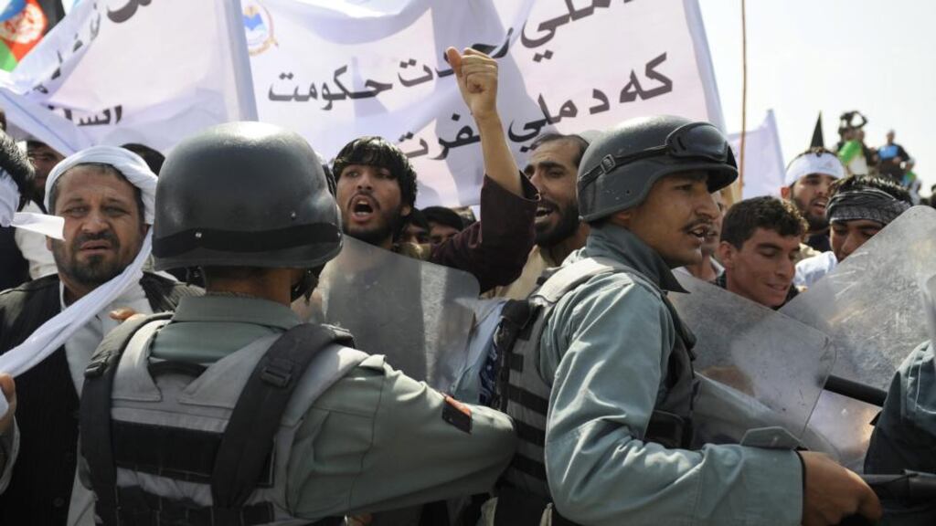 Afghans clash with members of the national security forces during an anti-Government protest in Kabul, Afghanistan. Photograph: Hedayatullah Amid/EPA