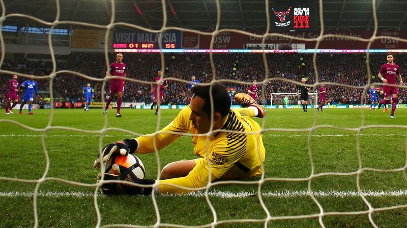 Claudio Bravo makes a save during Manchester City’s win over Cardiff. Photograph: Michael Steele/Getty