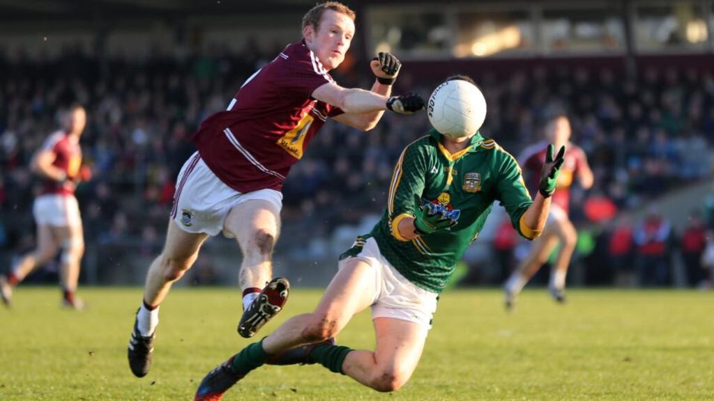 Westmeath’s Damien Dolan and Damien Carroll of Meath contest a loose ball. Photograph: Cathal Noonan / Inpho