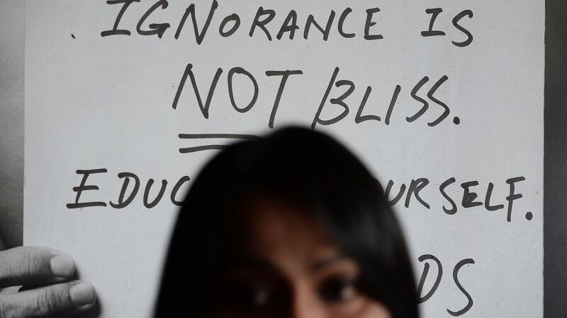 A picture from May 12th, 2016 shows a banner reading “ Ignorance is not bliss” in the backdrop as Malaysian LGBT activist Nisha Ayub speaks during an interview with AFP at SEED Foundation, an NGO she runs in Kuala Lumpur. She has said the health ministry contest encourages “discrimination, hatred and even violence” towards minority groups. File photograph: Manan Vatsyayana/AFP/Getty Images