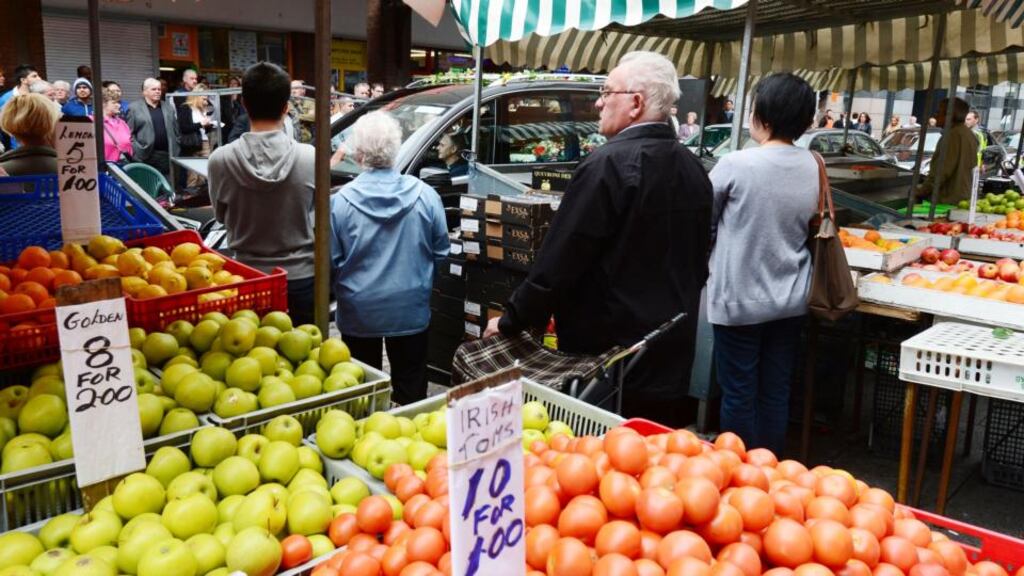 Stalls on Moore street come to a standstill as the funeral of Mary Kavanagh passed her empty stall. She was born on the street in 1921 and sold from her stall from the age of 7 until 3 years ago. Photograph: Alan Betson / THE IRISH TIMES
